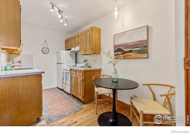 1430 18th St Unit 1, Boulder, CO 80302 - kitchen with white electric range oven, decorative backsplash, light wood-style flooring, and light countertops