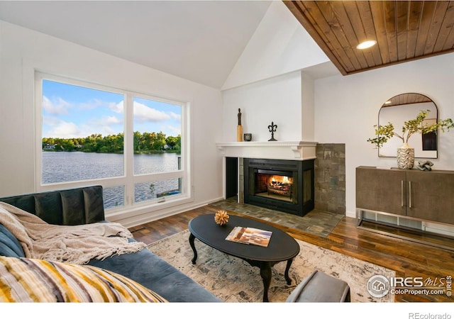 547 Spindrift Ct, Fort Collins, CO 80525 - living room featuring a water view, a multi sided fireplace, wood finished floors, and lofted ceiling