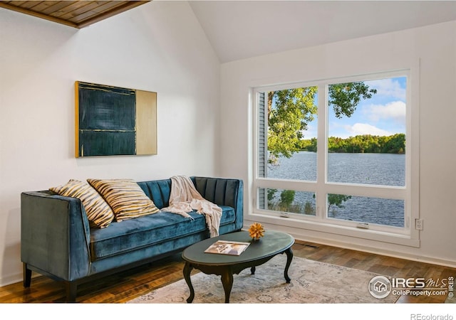 547 Spindrift Ct, Fort Collins, CO 80525 - living room featuring vaulted ceiling, wood finished floors, and a water view