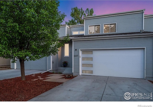 547 Spindrift Ct, Fort Collins, CO 80525 - view of front of home with driveway and a garage
