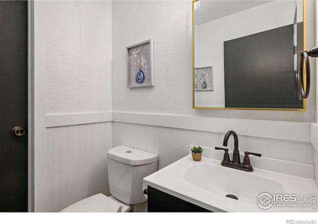 547 Spindrift Ct, Fort Collins, CO 80525 - bathroom featuring vanity and wainscoting
