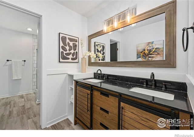 547 Spindrift Ct, Fort Collins, CO 80525 - full bathroom with double vanity and wood finished floors