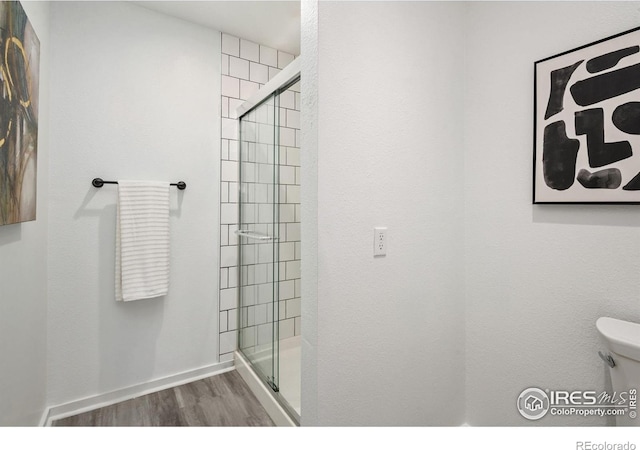 547 Spindrift Ct, Fort Collins, CO 80525 - bathroom featuring wood finished floors and a shower stall