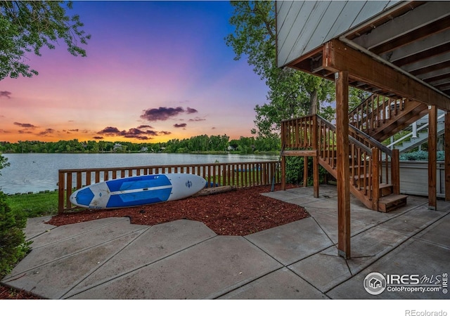 547 Spindrift Ct, Fort Collins, CO 80525 - view of patio / terrace featuring a water view and stairway