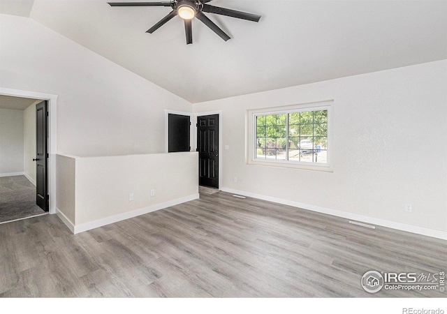 4386 Suncreek Dr, Loveland, CO 80538 - empty room featuring ceiling fan, wood finished floors, and high vaulted ceiling