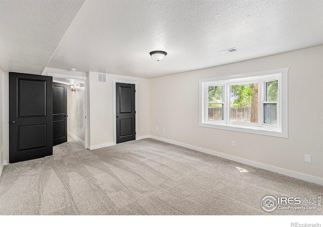 4386 Suncreek Dr, Loveland, CO 80538 - unfurnished bedroom featuring a textured ceiling and carpet flooring