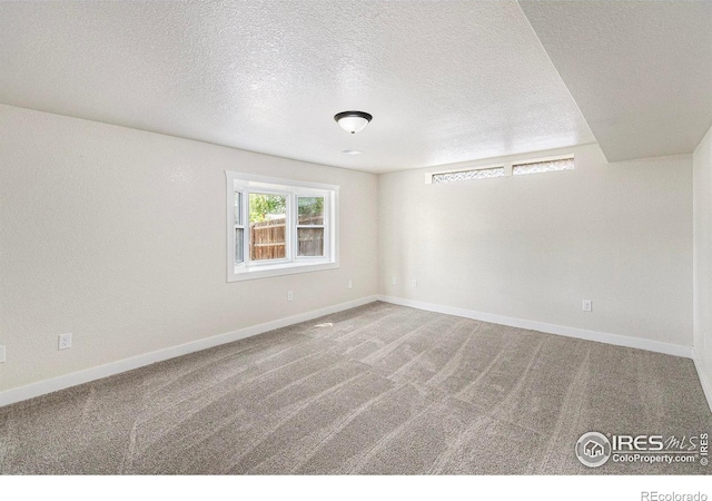 4386 Suncreek Dr, Loveland, CO 80538 - carpeted empty room featuring a textured ceiling and baseboards