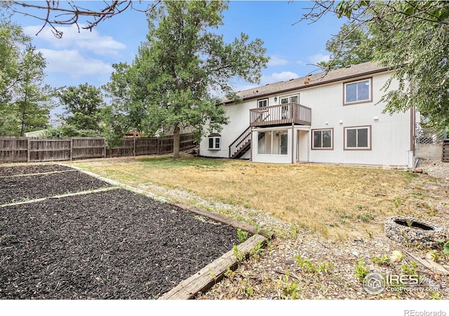 4386 Suncreek Dr, Loveland, CO 80538 - fenced backyard with stairway and a deck