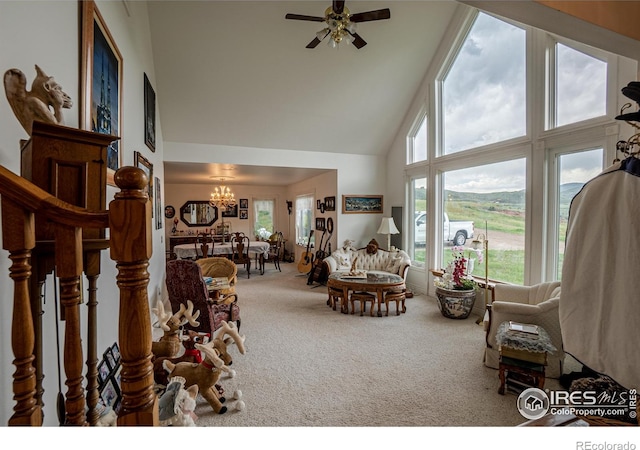 12711 Buckhorn Rd, Loveland, CO 80538 - living room with carpet, high vaulted ceiling, a chandelier, and ceiling fan
