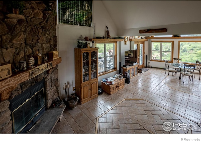 12711 Buckhorn Rd, Loveland, CO 80538 - living area with a stone fireplace and high vaulted ceiling
