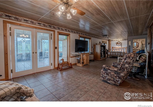 12711 Buckhorn Rd, Loveland, CO 80538 - tiled living room featuring french doors, ceiling fan, and wood ceiling