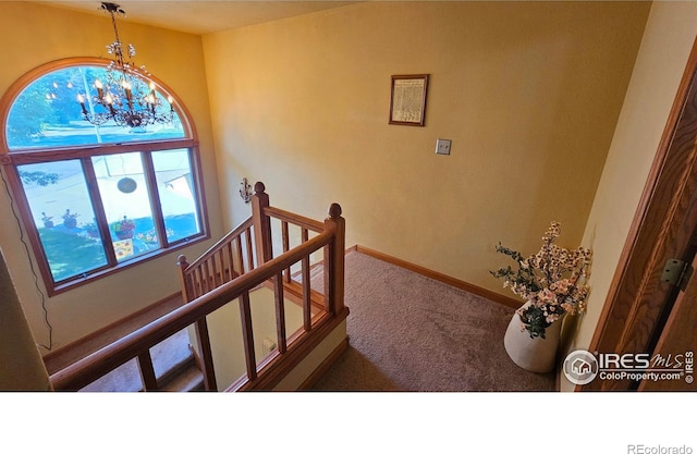 420 Applewood St, Brush, CO 80723 - stairs featuring carpet flooring and a chandelier