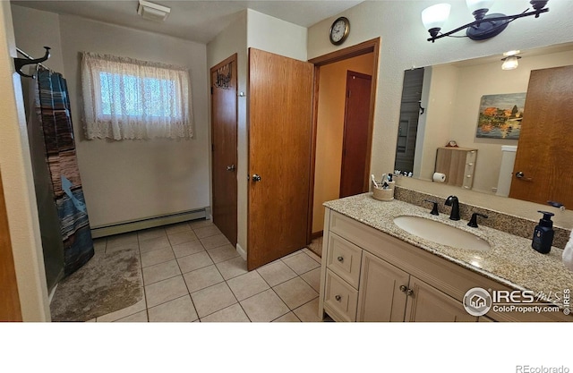 420 Applewood St, Brush, CO 80723 - bathroom featuring a baseboard radiator, vanity, and tile patterned floors