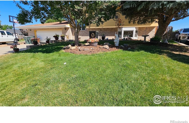 420 Applewood St, Brush, CO 80723 - view of front of home featuring brick siding, an attached garage, and a front lawn