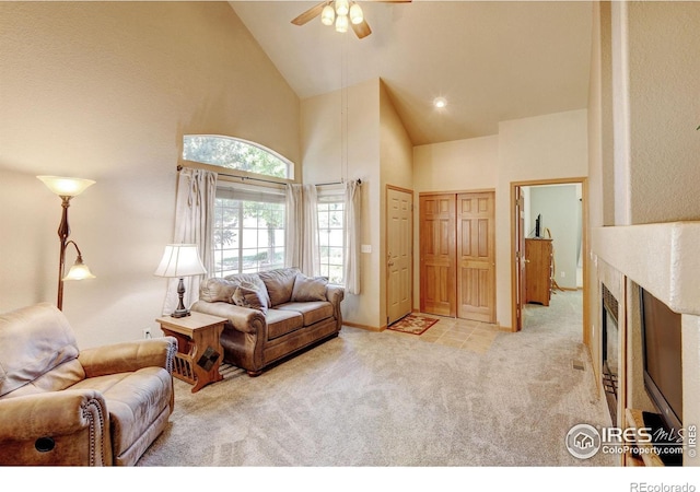 4500 Seneca St Unit 11, Fort Collins, CO 80526 - carpeted living area featuring high vaulted ceiling, a ceiling fan, and a fireplace