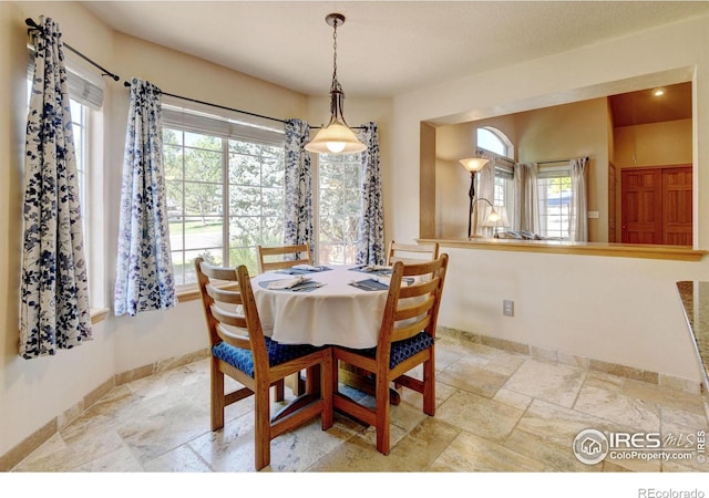 4500 Seneca St Unit 11, Fort Collins, CO 80526 - dining space with plenty of natural light and stone finish floors