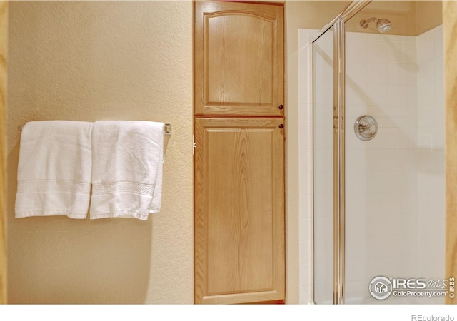 4500 Seneca St Unit 11, Fort Collins, CO 80526 - bathroom with a stall shower and a textured wall