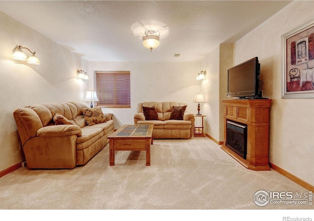 4500 Seneca St Unit 11, Fort Collins, CO 80526 - carpeted living room with a fireplace and baseboards