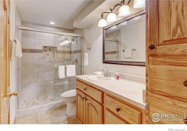 4500 Seneca St Unit 11, Fort Collins, CO 80526 - bathroom with vanity, a shower stall, tile patterned floors, and recessed lighting