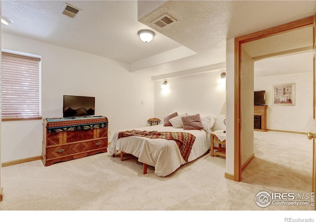 4500 Seneca St Unit 11, Fort Collins, CO 80526 - carpeted bedroom with baseboards and a textured ceiling
