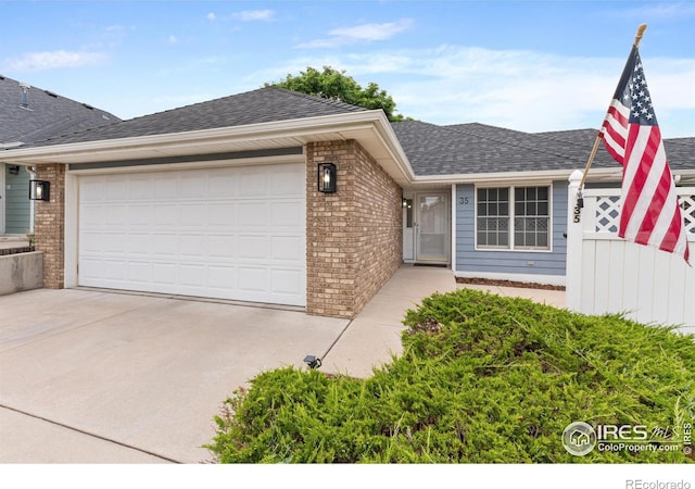 3822 W 11th St Unit 35, Greeley, CO 80634 - ranch-style home featuring a garage, brick siding, and concrete driveway