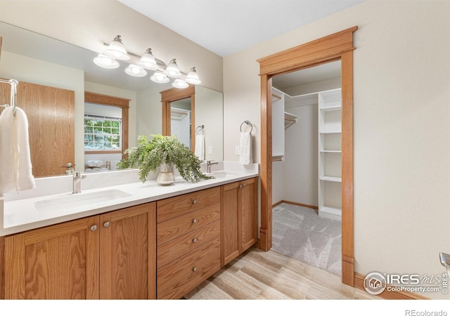 3822 W 11th St Unit 35, Greeley, CO 80634 - bathroom with double vanity and wood finished floors
