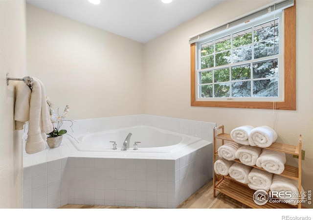 3822 W 11th St Unit 35, Greeley, CO 80634 - bathroom featuring a garden tub, wood finished floors, and recessed lighting