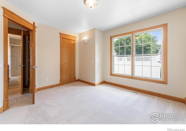 3822 W 11th St Unit 35, Greeley, CO 80634 - unfurnished bedroom with light colored carpet and a closet