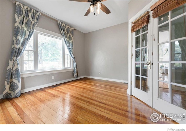 511 E Prospect Rd, Fort Collins, CO 80525 - empty room with hardwood / wood-style flooring, a ceiling fan, and french doors