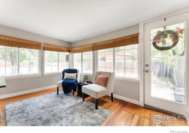 511 E Prospect Rd, Fort Collins, CO 80525 - sunroom / solarium with healthy amount of natural light and hardwood / wood-style flooring