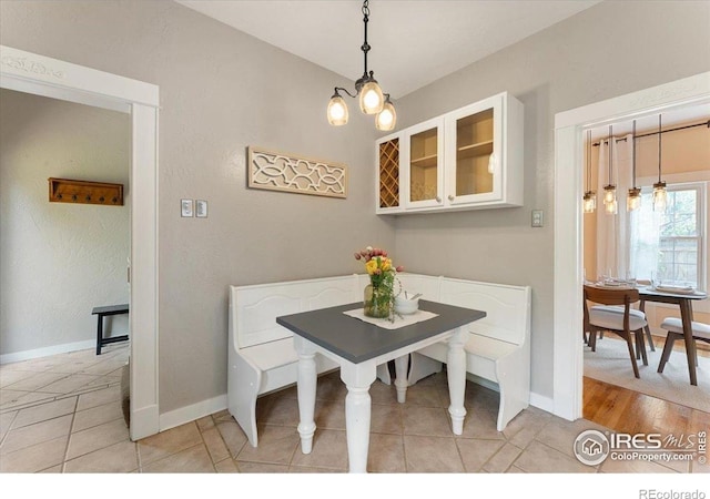 511 E Prospect Rd, Fort Collins, CO 80525 - dining area with breakfast area, light tile patterned flooring, and a chandelier
