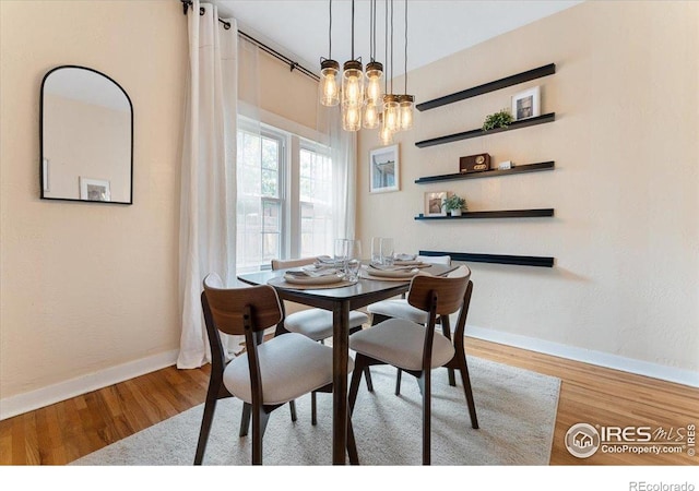 511 E Prospect Rd, Fort Collins, CO 80525 - dining room featuring wood finished floors and a chandelier