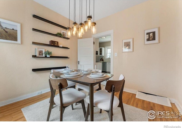 511 E Prospect Rd, Fort Collins, CO 80525 - dining area featuring wood finished floors and a chandelier