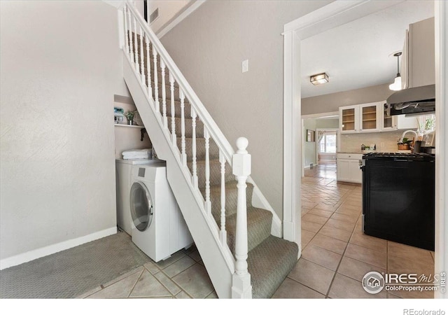 511 E Prospect Rd, Fort Collins, CO 80525 - stairway featuring washer / dryer and tile patterned flooring