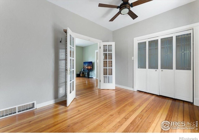 511 E Prospect Rd, Fort Collins, CO 80525 - spare room with french doors, a ceiling fan, and wood finished floors