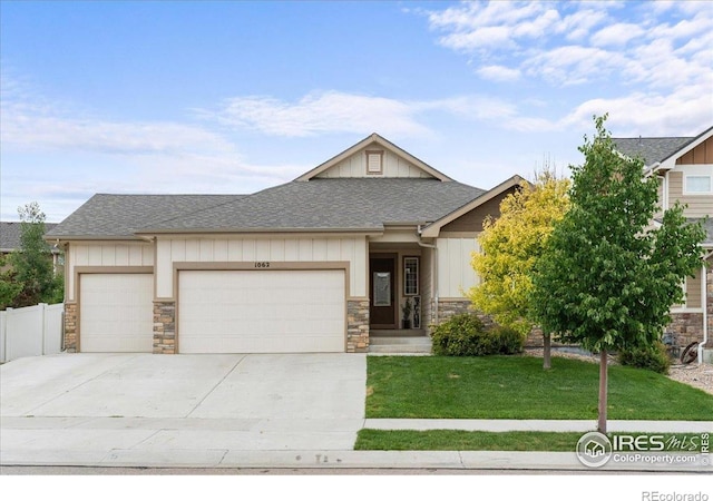 1062 Mt Columbia Dr, Severance, CO 80550 - craftsman inspired home featuring stone siding, roof with shingles, an attached garage, and driveway