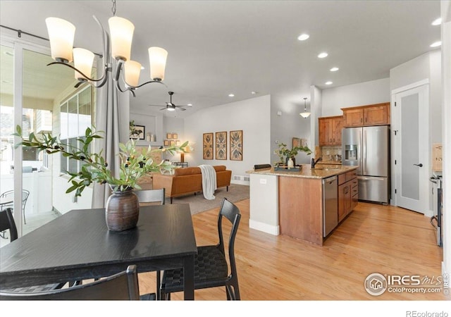 1062 Mt Columbia Dr, Severance, CO 80550 - dining area with light wood-style flooring, recessed lighting, a chandelier, and ceiling fan