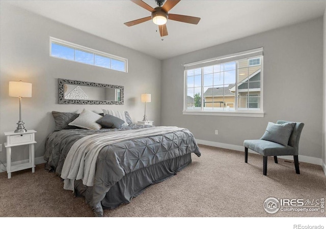 1062 Mt Columbia Dr, Severance, CO 80550 - carpeted bedroom featuring multiple windows and a ceiling fan