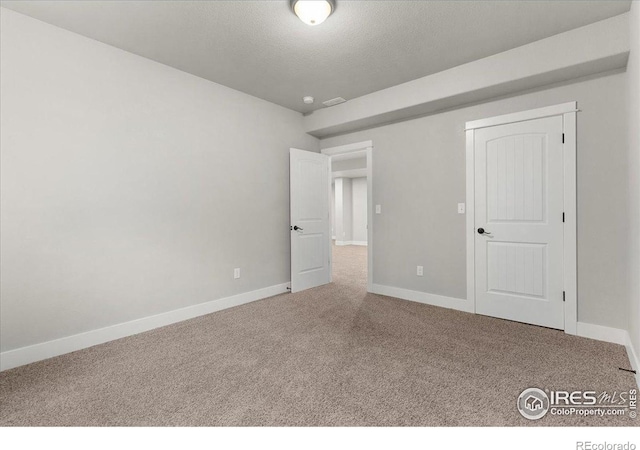 1062 Mt Columbia Dr, Severance, CO 80550 - unfurnished bedroom with carpet flooring and a textured ceiling