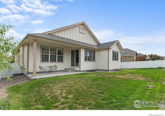 1062 Mt Columbia Dr, Severance, CO 80550 - back of house with board and batten siding, a patio area, and a shingled roof