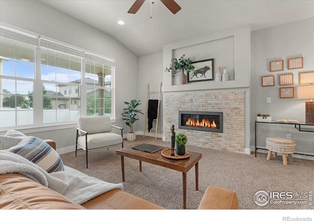 1062 Mt Columbia Dr, Severance, CO 80550 - carpeted living area with ceiling fan, a glass covered fireplace, vaulted ceiling, and recessed lighting