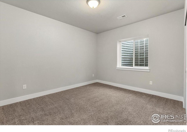 1062 Mt Columbia Dr, Severance, CO 80550 - unfurnished room featuring carpet floors and a textured ceiling