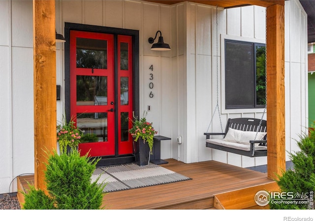 4306 Dixon St, Timnath, CO 80547 - doorway to property featuring covered porch and board and batten siding