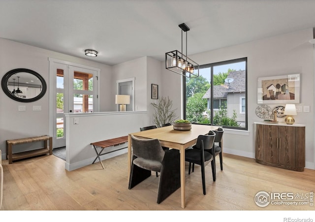 4306 Dixon St, Timnath, CO 80547 - dining room with light wood finished floors and a chandelier