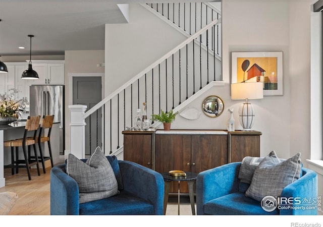 4306 Dixon St, Timnath, CO 80547 - living area featuring stairway, light wood-style floors, and recessed lighting