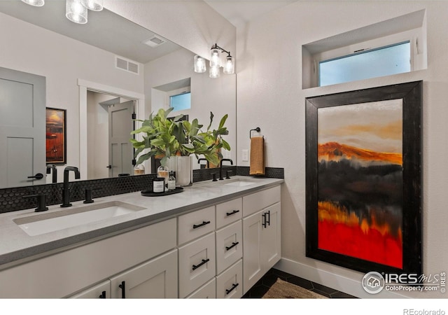 4306 Dixon St, Timnath, CO 80547 - bathroom featuring double vanity and tile patterned flooring