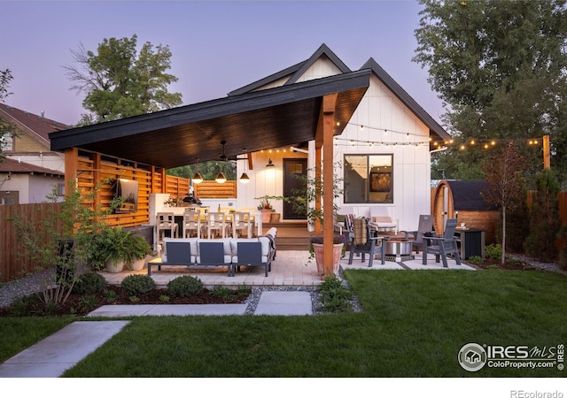 4306 Dixon St, Timnath, CO 80547 - rear view of house featuring an outdoor hangout area, a patio, board and batten siding, a shed, and a ceiling fan
