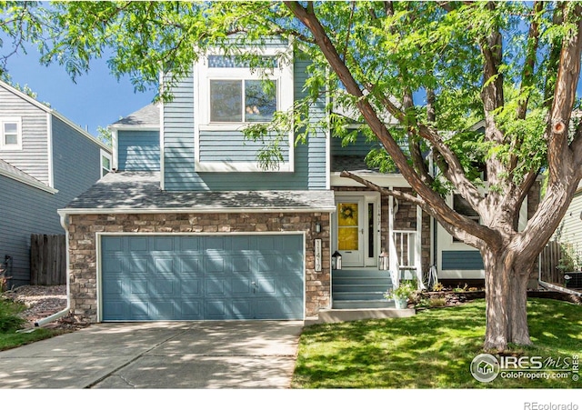 11417 King Way, Westminster, CO 80031 - view of front of home featuring stone siding, concrete driveway, a garage, and a front lawn