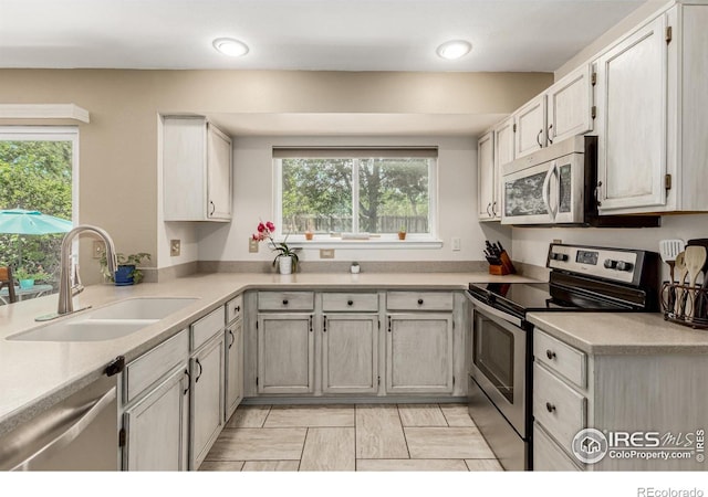 11417 King Way, Westminster, CO 80031 - kitchen featuring appliances with stainless steel finishes, plenty of natural light, light countertops, and recessed lighting