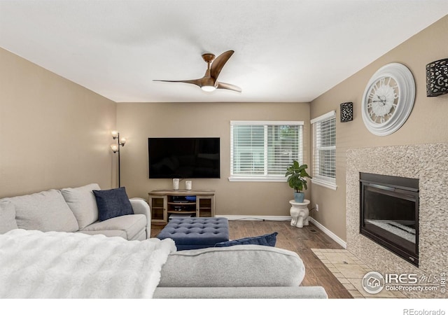 11417 King Way, Westminster, CO 80031 - living area featuring wood finished floors, a tile fireplace, and ceiling fan